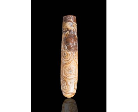 Ca. 300 - 100 BC.A hellenistic banded agate carved alabastron, with a teardrop shaped body and a rounded base. The alabastron