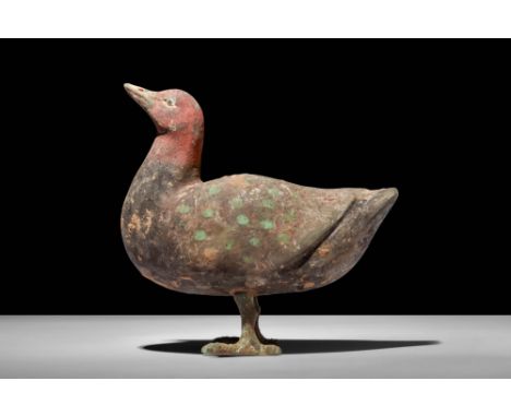 Ca. 202 BC - AD 220.A Han dynasty terracotta duck. The duck is positioned with its head held high and is supported on two bro