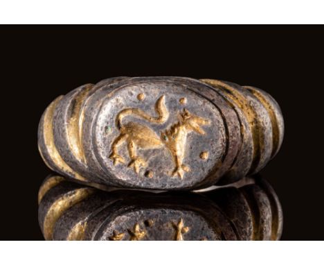 Ca. AD 1000 - 1200.A Byzantine heavy silver gilt ring with a large D-section hoop widening on the shoulders to form an oval b