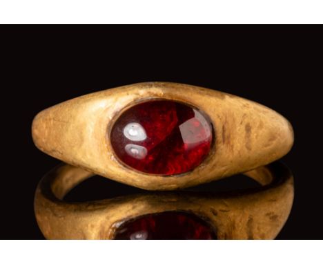 Ca. AD 400 - 600.A Merovingian gold ring with an angular hoop and with a D section that enlarges on the shoulders to form an 