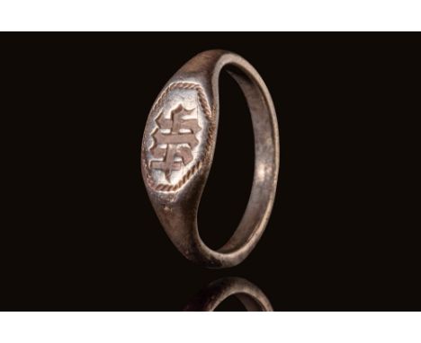 Ca. AD 1400 - 1520. A medieval silver ring with a round flat sectioned hoop that enlarges on the shoulders to form a bezel. T