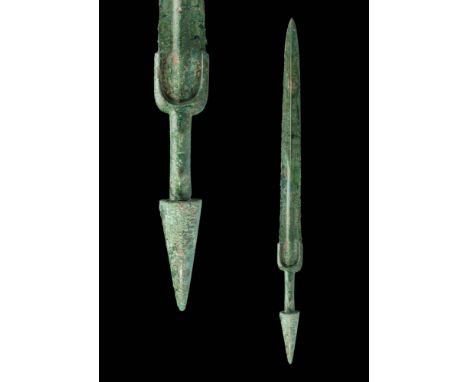 Ca. 1200 - 800 BC.A Western Asiatic/Aegean bronze dagger with a long, tapering blade, a prominent large mid-rib and a gracefu