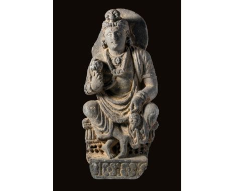 Ca. 200 - 400 BC. A stone statue of Padmapani, a form of Avalokitesvara. The seated figure is shown seated, one hand holding 