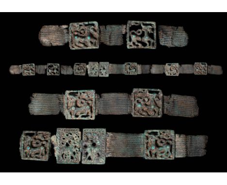 Ca. 1000 BC. An impressive Ordos bronze belt with eight plaques depicting mythological animals. The belt is composed of plaqu