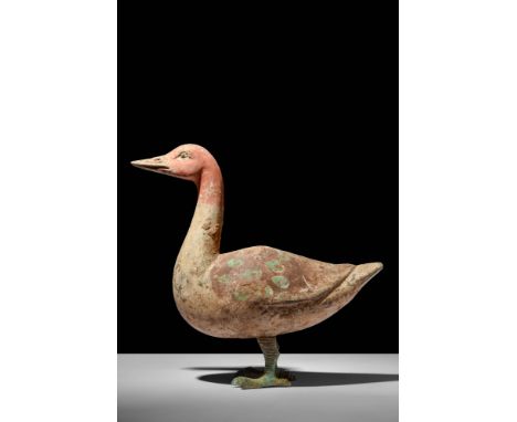 Ca. 202 BC - AD 220.A Han dynasty terracotta goose. The goose is standing still with its head held high and is supported by b