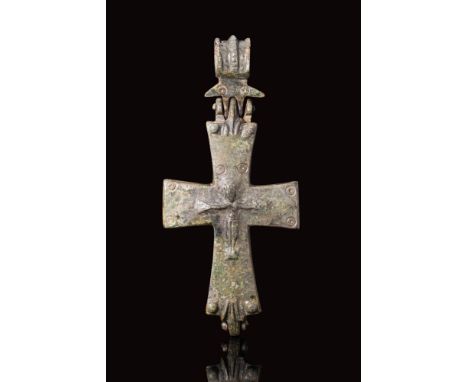 Ca. AD 900 - 1000.A Byzantine bronze reliquary cross comprised of two crosses held together by hinges at top and bottom. This