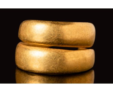 Ca. 600 BC.A Celtic or late Bronze Age solid gold ring with a polished surface. The ring is formed into the shape of a spiral