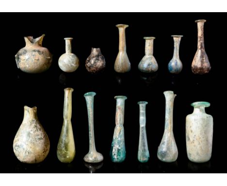 Ca. AD 100 - 400.A large collection of Roman glass vessels comprised of differing shapes and hues. For similar see: The Cesno
