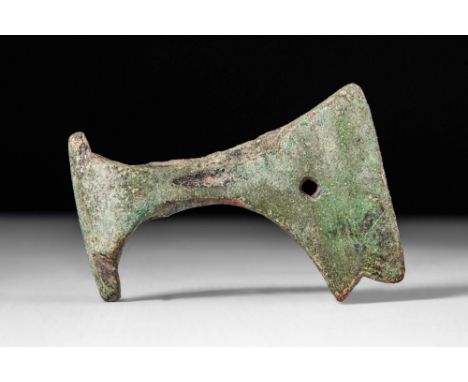 Ca. AD 800 - 1000.A Viking bronze ritual axe head. The axe head has a broad blade that is flared to the curved cutting edge a