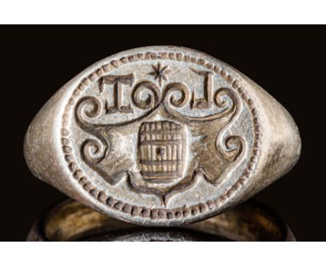 Ca. AD 1400 - 1500.A late Medieval or Renaissance silver ring with an oval bezel, depicting a heraldic seal. The seal consist
