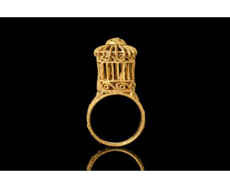 Ca. AD 1000 - 1200.A stunning Fatimid gold ring shaped like a domed cage with two little birds inside. The ring is constructe