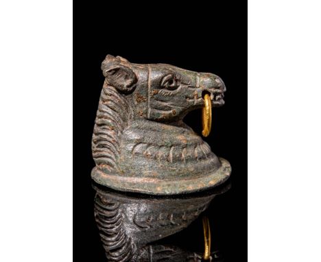 Ca. AD 100 - 300.A high-quality Roman bronze applique in the shape of a horse's head. His neatly manicured mane is marked wit