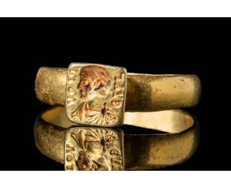 Ca. AD 300 - 400. A late Roman gold ring with a square bezel, upon which is an engraving of an emperor from the House of Cons