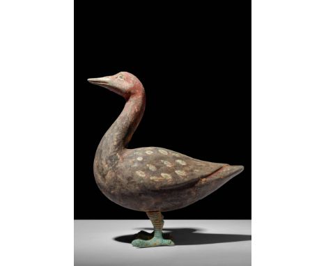 Ca. 202 BC - AD 220.A Han dynasty terracotta goose. The goose is standing still with its head held high and is supported by b
