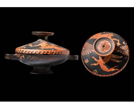Ca. 330 - 300 BC. An Apulian red-figure lekanis decorated with a lady of fashion and a winged victory, alternated with two st