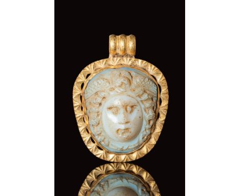 Ca. AD 200 - 300.A late Roman gold pendant with an agate cameo of Medusa's head made in a naturalistic manner. Medusa has a l