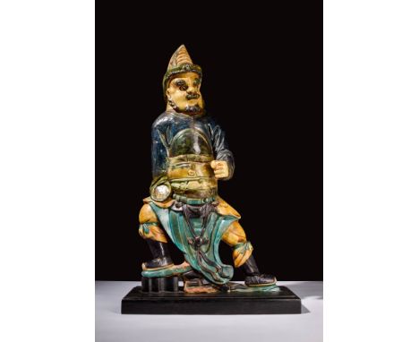 Ca. AD 1368 - 1644.A Ming dynasty terracotta figure depicting a warrior. The black, yellow and turquoise glazed figure stands
