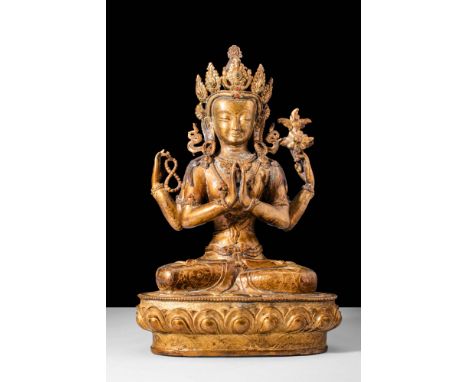 Ca. AD 1800-1900.A beautiful seated, gilded and bejewelled bronze Avalokitesvara. Avalokitesvara is portrayed as a male deity