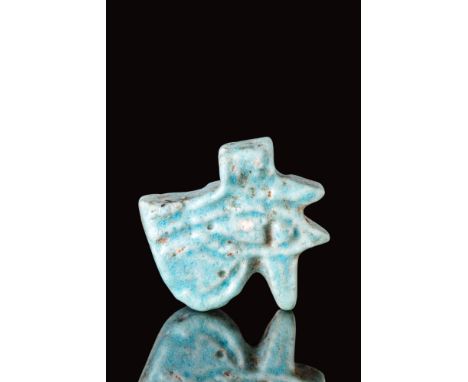 Late Period, Ca. 664 - 30 BC.An Egyptian green faience amulet depicting the "Eye of Horus," an ancient eye symbol of protecti