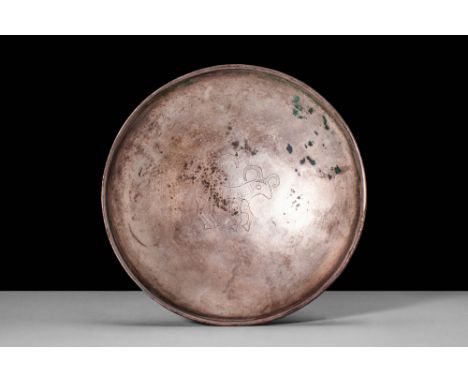 Ca. AD 200 - 500.A Sassanian shallow bowl of lustrous silver hues with a round form. The bowl features a round form with a de