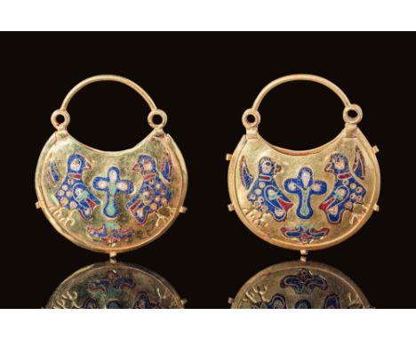 Ca. AD 1100 - 1200. A magnificent pair of matching Byzantine gold earrings with lunar-shaped bodies composed of two gold leav