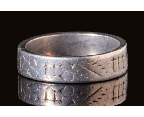 Ca. AD 700 - 900.A Saxon Era, possibly continental silver ring. It has a flat round hoop, embellished on the exterior with a 