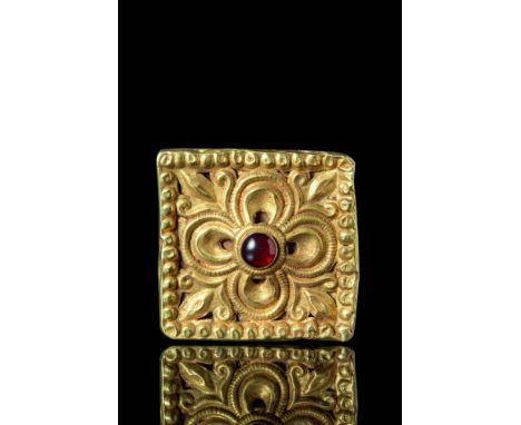 Ca. AD 700 - 900.A stunning Byzantine gold square hollow pendant. The center is embellished with an eight petalled flower, th