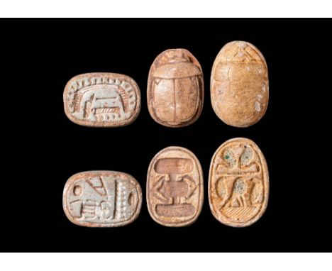 Middle kingdom, 2055 - 1790 BC. Collection of three Egyptian steatite scarabs. The first scarab on the left with realistic ma