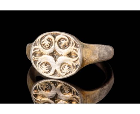 Ca. AD 1000 - 1300.A Byzantine silver gilt ring comprising of a round D sectioned hoop that widens on the shoulders, to form 