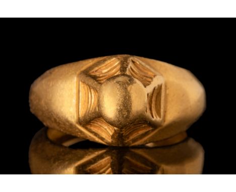 Ca. AD 500 - 700. A rare Byzantine gold bishop's ring with a domed bezel supported by six stylised columns. This kind of ring