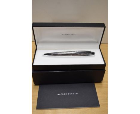 A boxed Alfred Dunhill AD2000 ballpiont pen in silver plate having fluted design, with care booklet