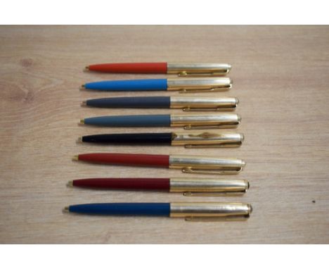 Eight Parker 61 ballpoint pens in Black, Grey, Teal, Red, Burgundy all with fluted gold fill caps (wear to the black pen cap)