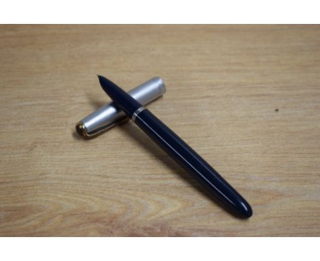 A Parker 51 plunger fill fountain pen in dark blue with twin jewel sterling silver cap. Dents to cap