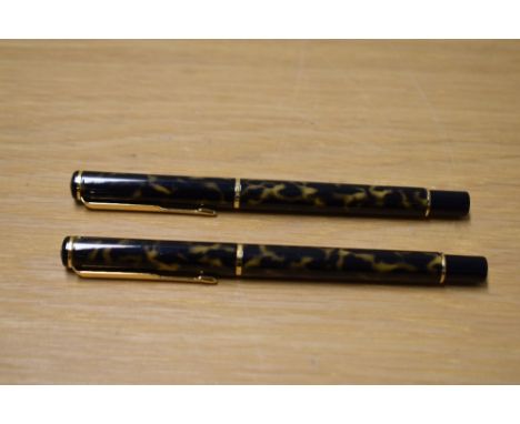 A Parker Rialto converter fill fountain pen and rollerball pen in Laque Dusk