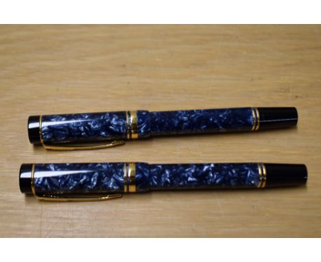 Two Parker Duofold rollerball pens in blue. No cartridge