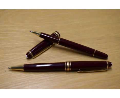 A Montblanc Meisterstuck Solataire Ballpoint pen (IH1514415) and Rollerball (DB154282) in Burgundy