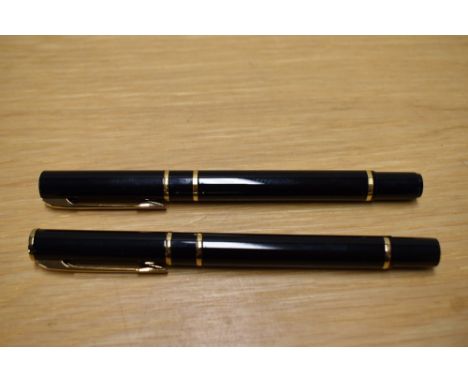 A Waterman Laureat cartridge converter fill fountain pen and rollerball pen in Black the fountain pen having a Waterman Franc