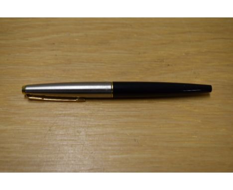 A Parker 45 cartridge fill fountain pen in black having a lutraloy cap with gold trim