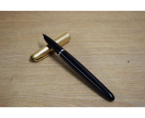 A Parker 51 aerometric fill fountain pen in black with rolled gold cap. Dents to cap