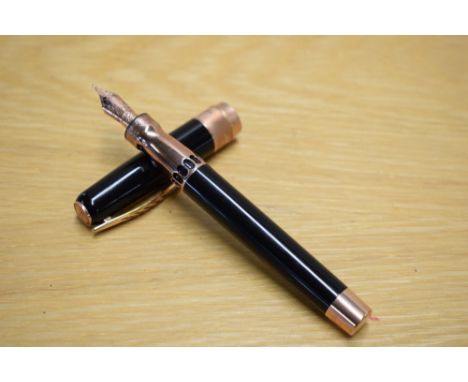 A boxed Pineider La Grand Bellezza piston fill fountain pen in black with Rose gold trim having Pineider M nib. The box is si