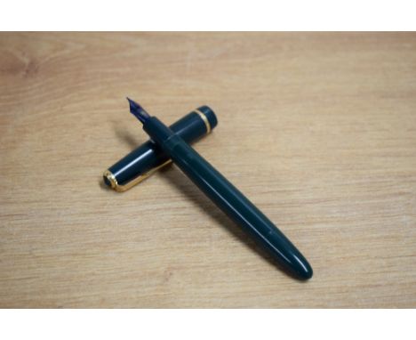 A Parker Duofold  aerometric fill fountain pen in green with Duofold cap band having Parker 14k England 10 nib