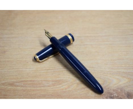 A Parker Duofold aerometric fill fountain pen in dark blue with Duofold broad cap band having Parker 14K England 25 nib