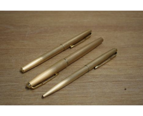 A Parker 61 Cirrus fountain pen, ballpoint pen and roller ball pen in brushed rolled gold (ballpoint engraved)