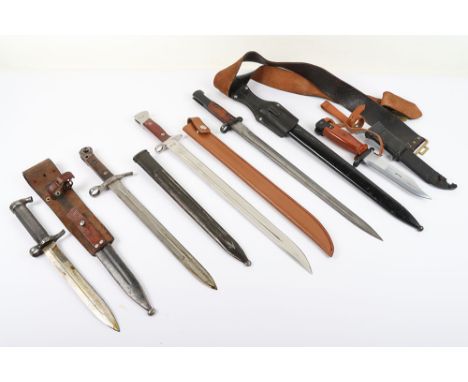 Grouping of Bayonets: Swedish 1896 bayonet with scabbard and leather frog, AKM bayonet, CCCP bayonet, bayonet on frog and bel