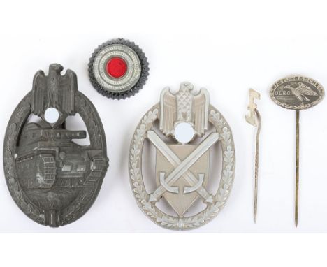 WW2 German Badges: Army marksmanship badge, Panzer assault combat badge, cap cockade and two stickpins. We believe these to b