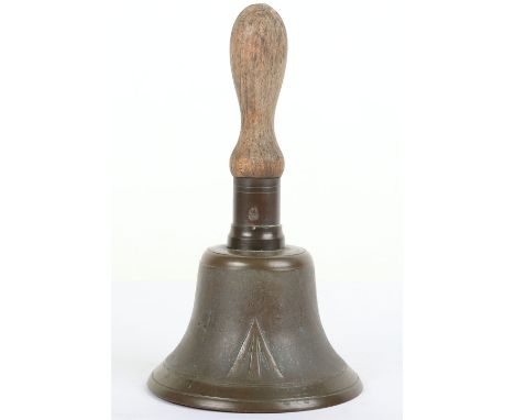 Military Hand Bell: Brass bell with large broad arrow to front with wooden handle,  27 cms high. 