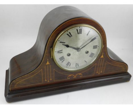 An Edwardian mahogany mantel clock, the silvered dial with Roman numerals, eight day movement, chiming gong. H.24cm W.45cm