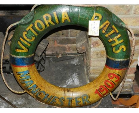 A decorative vintage style painted life ring.