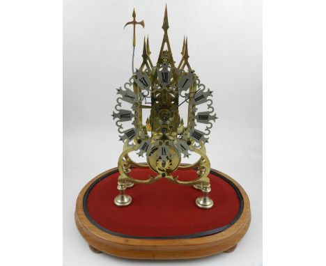 A 20th century skeleton clock, with single chain fusee movement, the silvered and pierced chapter ring with Roman numerals, t
