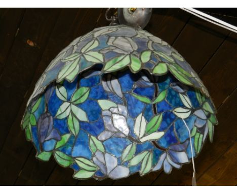 A Tiffany style ceiling light, having coloured leaded glass shade